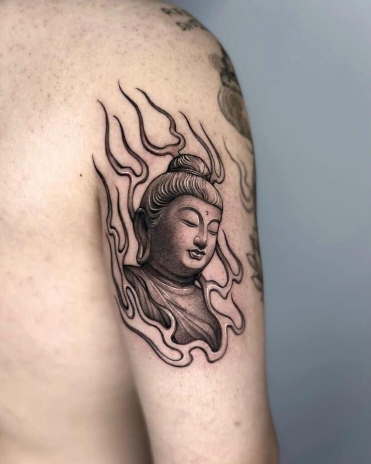 20. Ein Buddha-Tattoo auf der Rückseite des Arms
