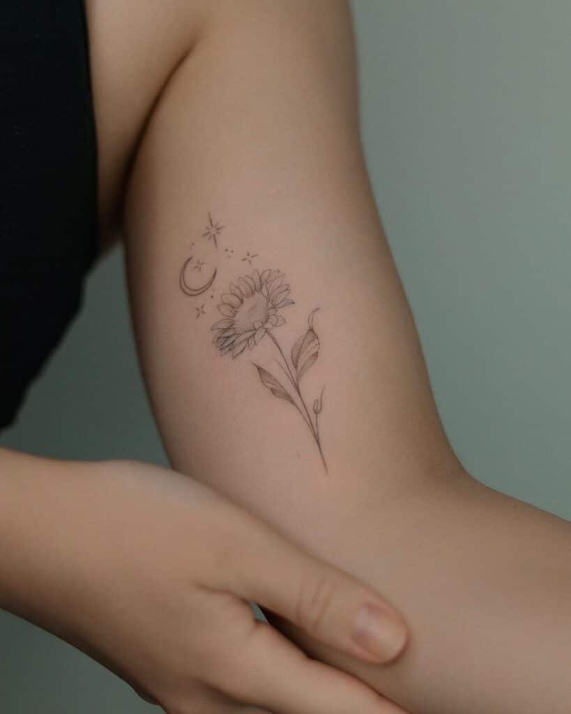 13. Ein zartes und zierliches Sonnenblumen-Tattoo 