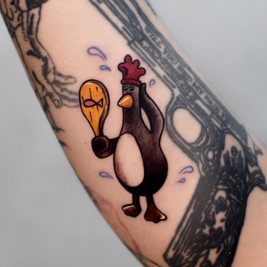 Cartoon-artige Pinguin-Tattoos
