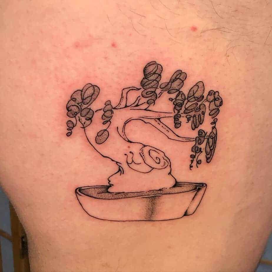 14. Schnecken-Bonsaibaum-Tattoo