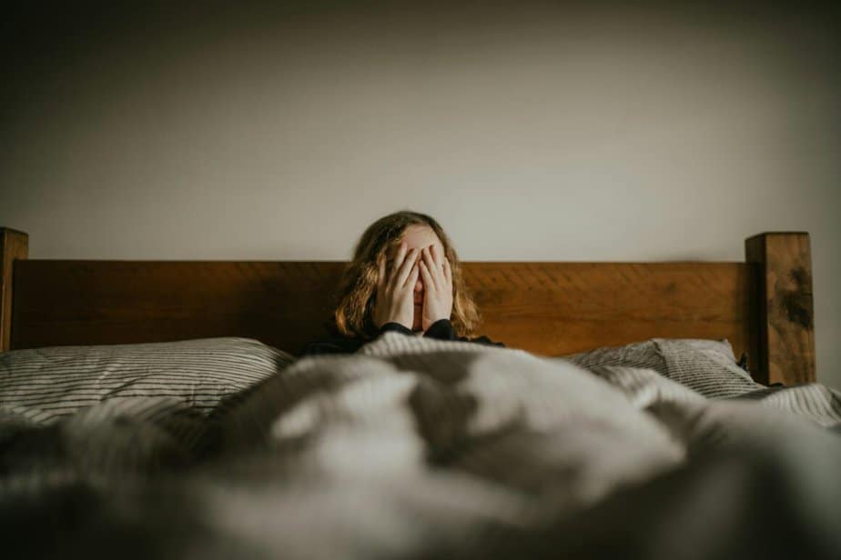 a woman in bed worrying This Is What It Feels Like When You're The Girl Who Is Too Familiar With Love That Leaves